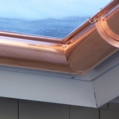 Copper half-round gutter showing hanger details